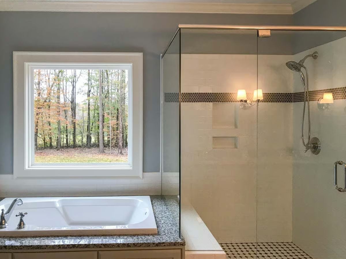 Soaking Tub Beside a Window Full of Fall Trees, Walk-In Shower Built to Last