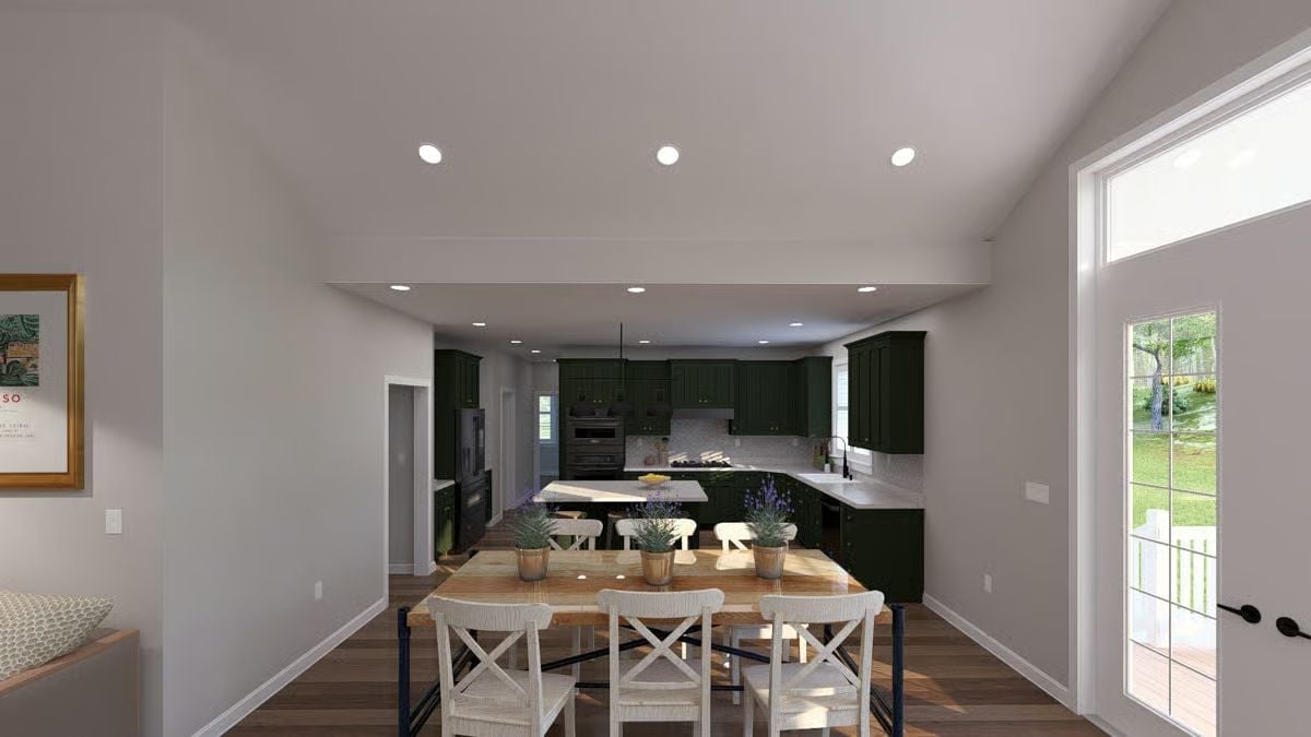 Green Cabinets, White Chairs, and an Open Plan That Earns Every Square Foot