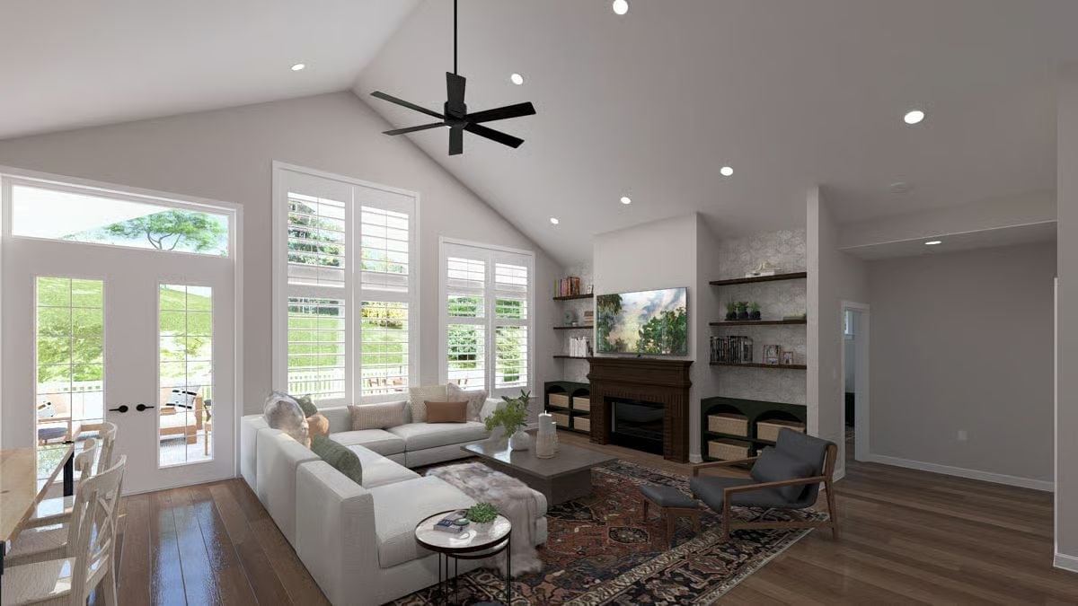 Vaulted Ceilings, a Dark Fireplace Surround, and Shutters That Do the Heavy Lifting