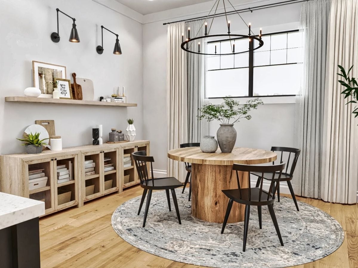 Round Wood Pedestal, Black Windsor Chairs, and a Chandelier That Means Business