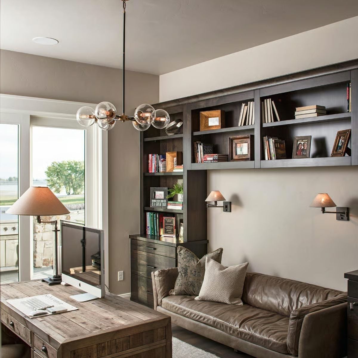 Globe Pendant, Leather Sofa, and Built-Ins That Earn Their Square Footage
