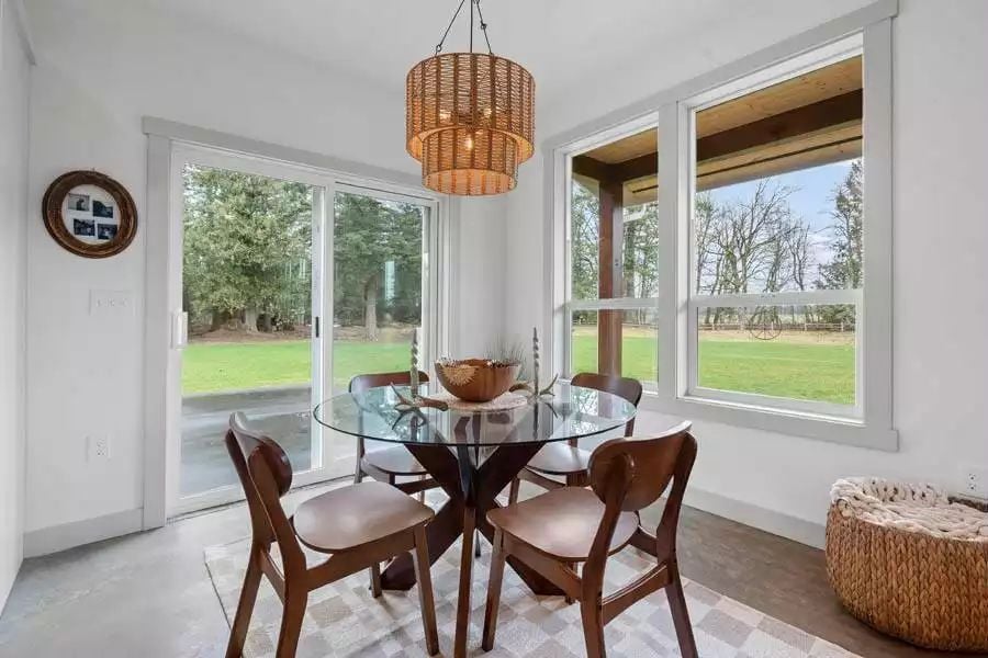 Rattan Light, Glass Table, and a Yard That Comes Right to the Door