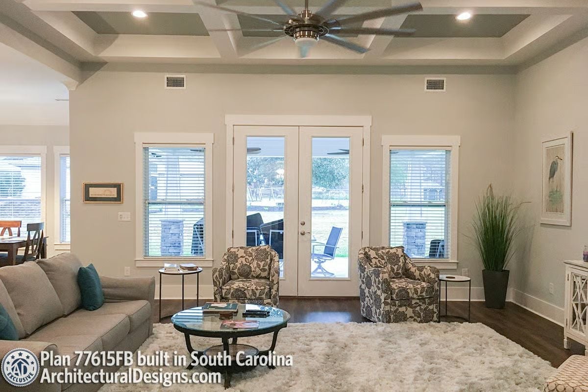 Coffered Ceiling and French Doors Make This Living Room Feel Twice Its Size