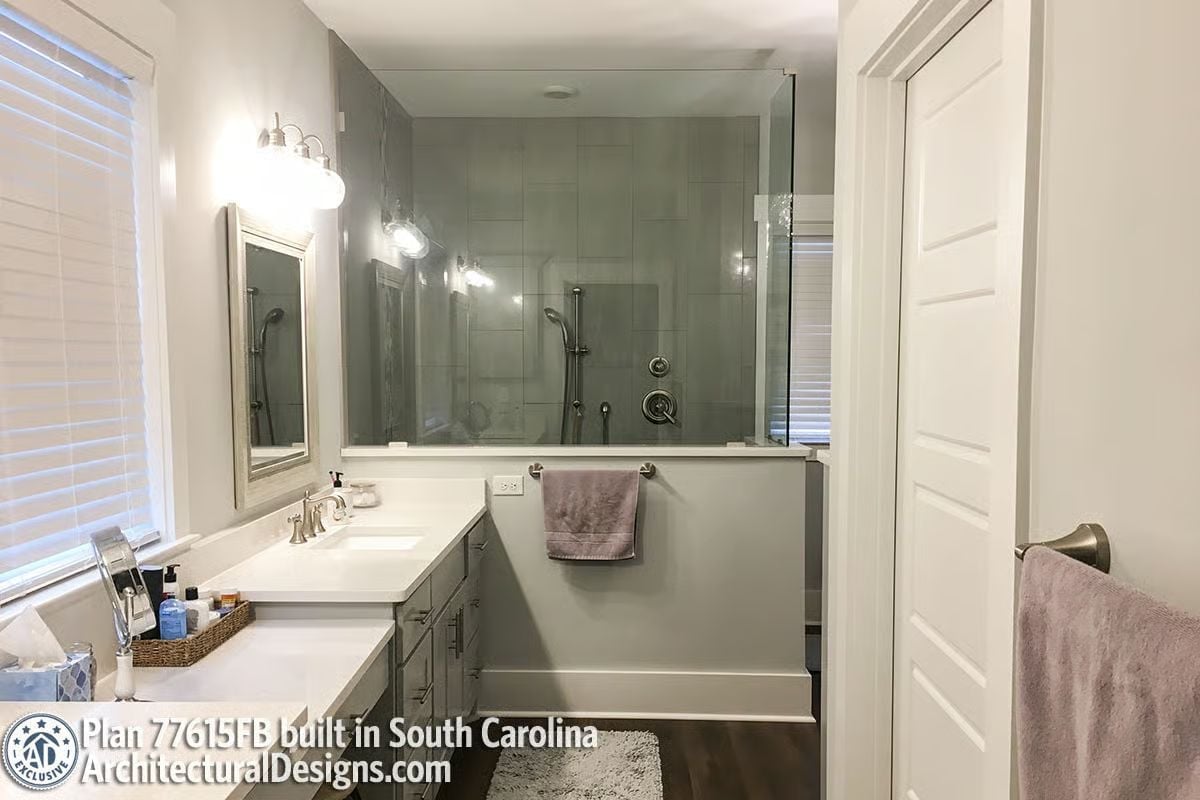 Half-Wall Between Vanity and Shower Pulls Double Duty Without Dividing the Room