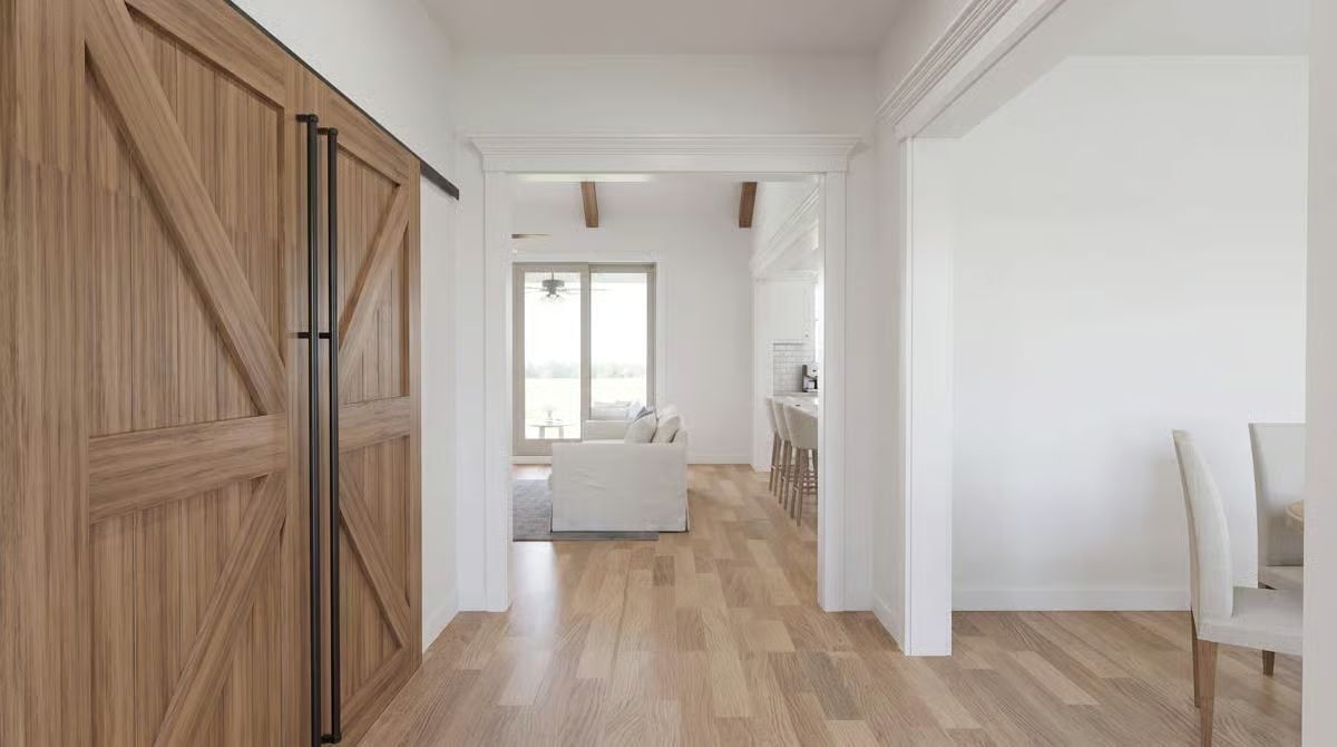 Barn Door Hardware and Exposed Beams Do the Heavy Lifting Here