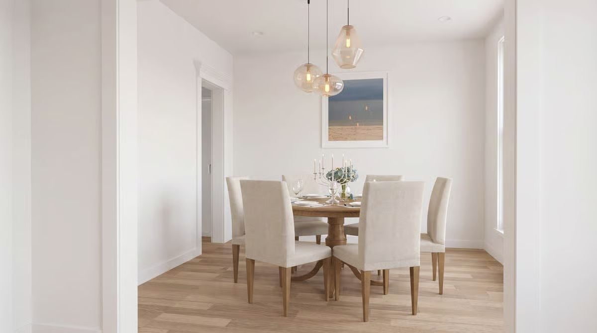 Pendant Cluster Over a Round Table Is the Oldest Trick in the Book — and It Still Works