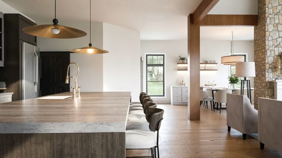 Brass Pendants and a Waterfall Island That Pull Two Rooms Into One Conversation