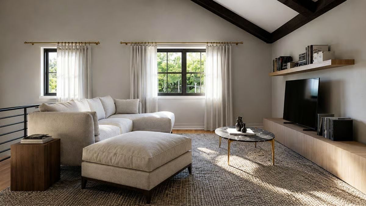 Vaulted Ceilings and Sheer Curtains Keep a Loft Living Room From Feeling Closed In