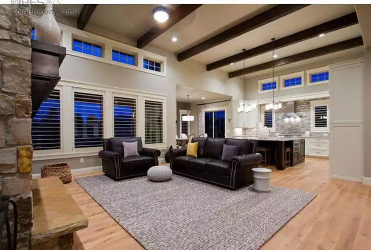 Leather, Exposed Beams, and a Kitchen That Refuses to Hide