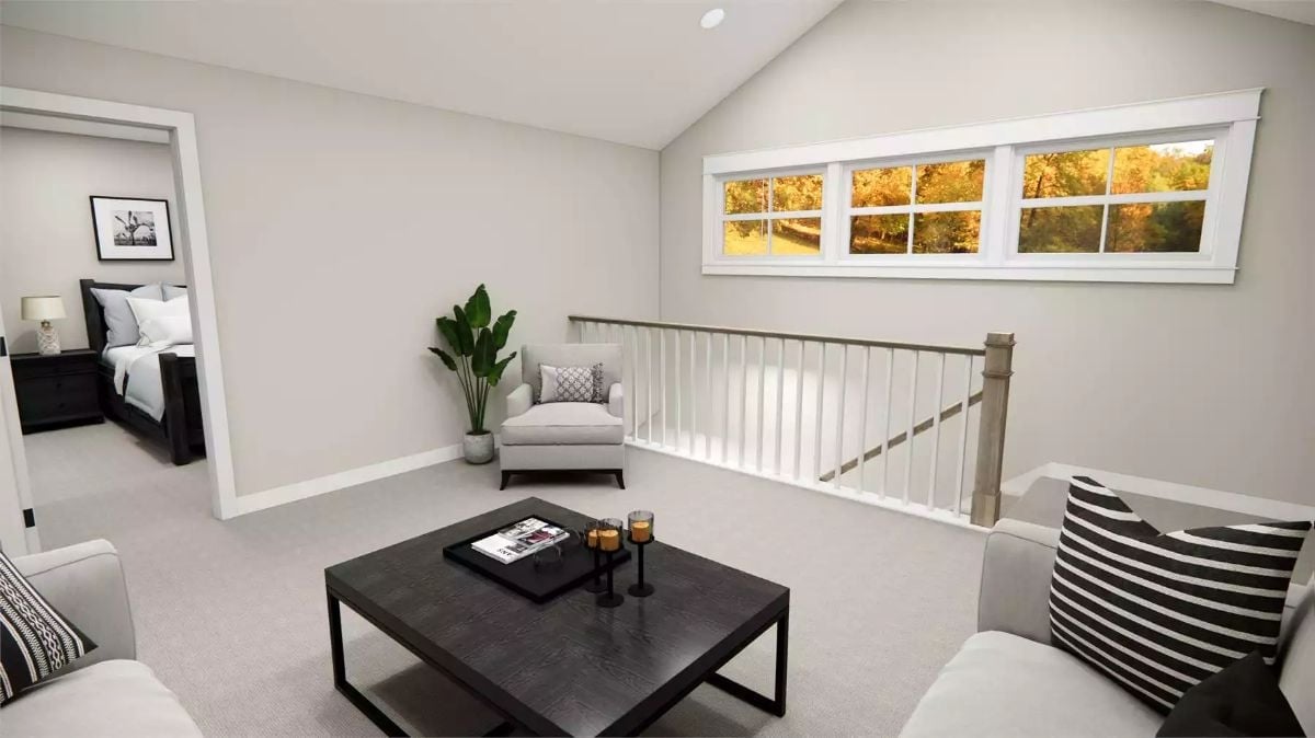 Loft Landing Area With Stair Rail, Accent Chair, and a Tree Line Doing the Decorating
