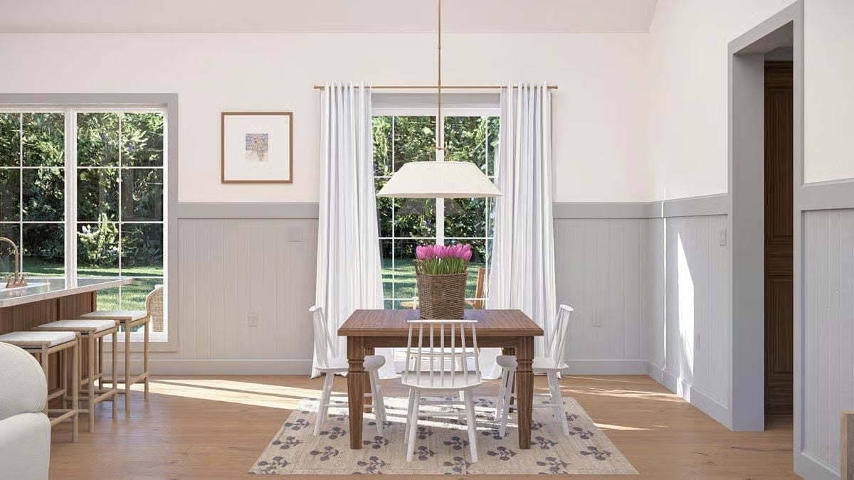 Wicker, Tulips, and White Spindle Chairs Around a Walnut Dining Table