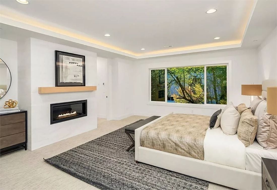 Cove Lighting and a Linear Fireplace Doing Exactly What a Primary Bedroom Asks For