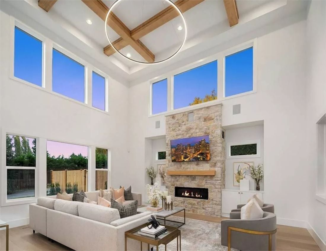 Soaring Ceilings and a Stone Fireplace Wall Built to Be the Room's Anchor