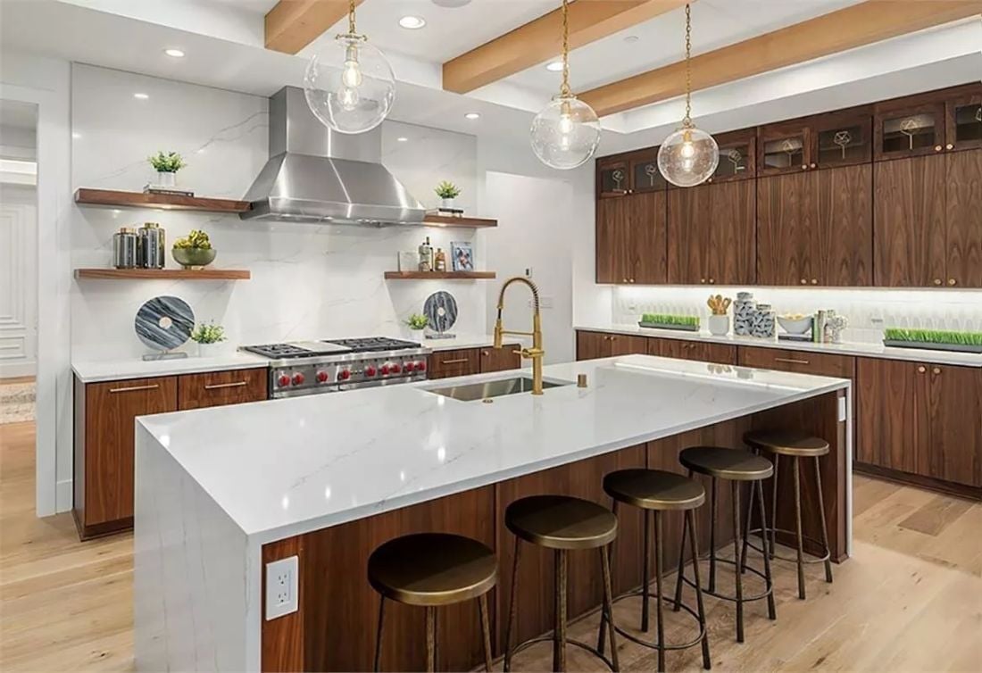Walnut Cabinets and Brass Hardware Doing the Heavy Lifting in This Kitchen