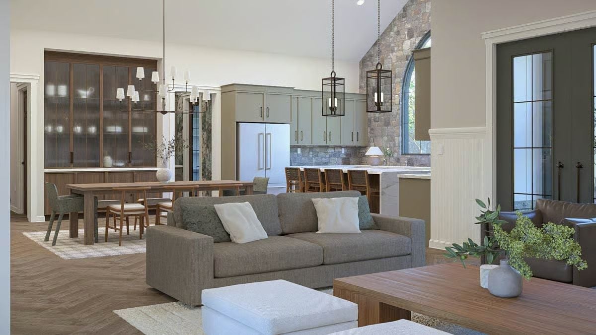 Sage Cabinets and Stone Make the Open Kitchen Feel Earned, Not Decorated
