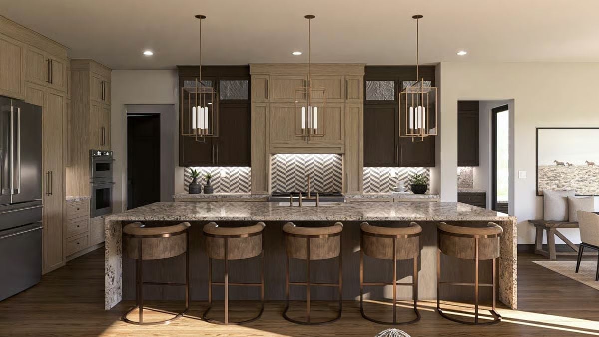 Copper-Tone Pendants and Granite Waterfall Edge Anchor This Kitchen Island