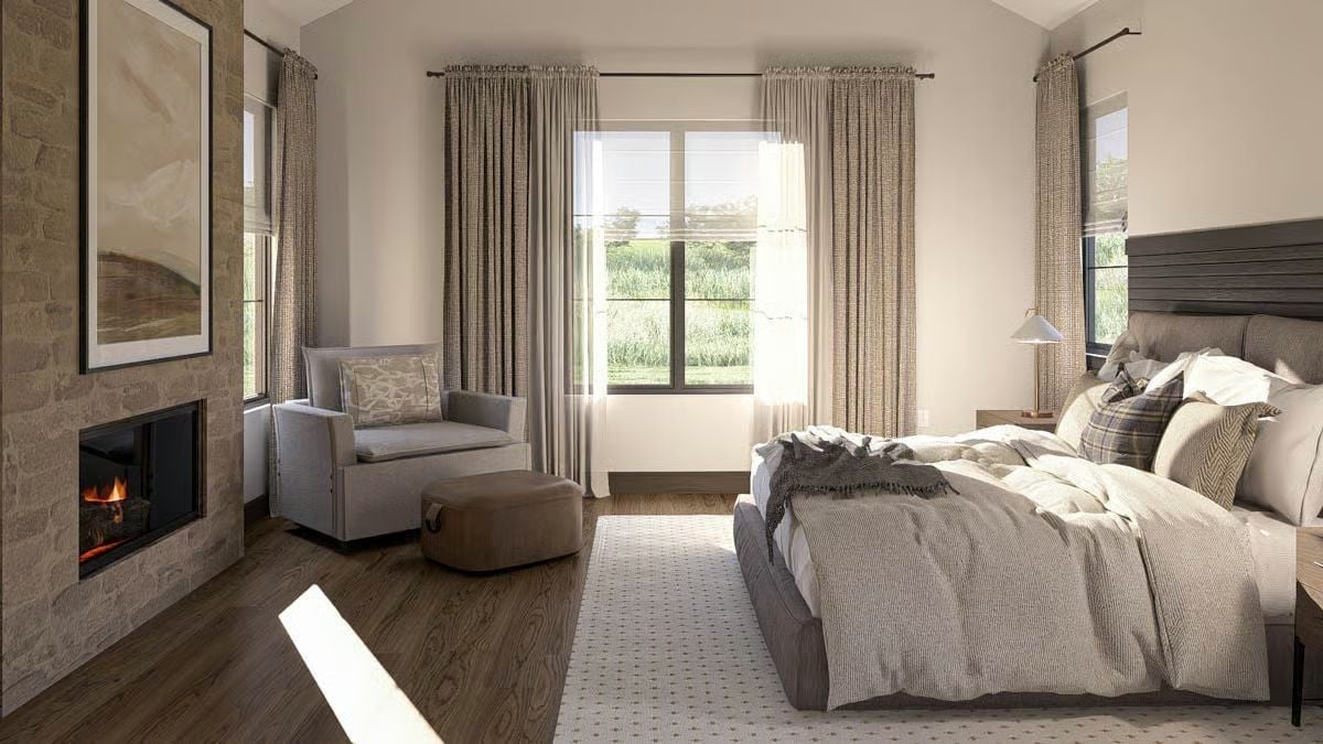 Firelight and Floor-to-Ceiling Linen Curtains Give This Bedroom Serious Retreat Energy