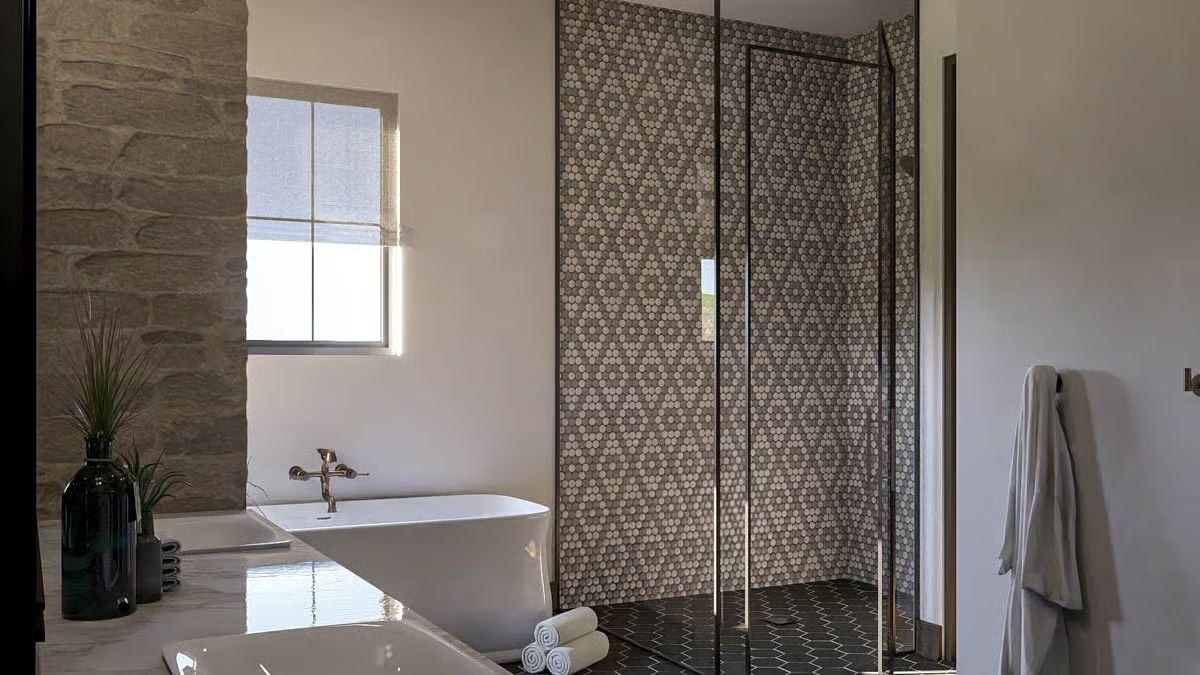 Penny Tile Walls and a Freestanding Tub Make This Bathroom Work Like a Spa