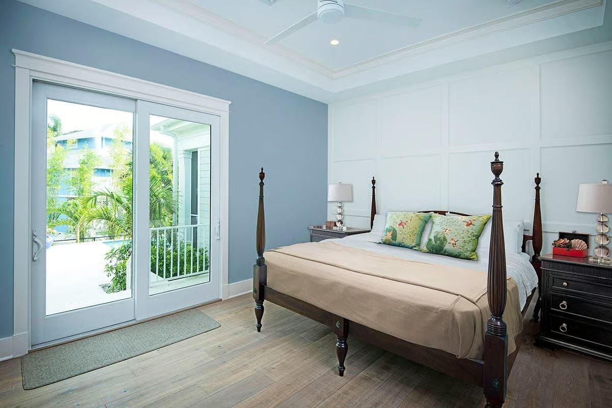 Four-Poster Beds and Sliding Glass Doors Are a Coastal Bedroom's Best Argument