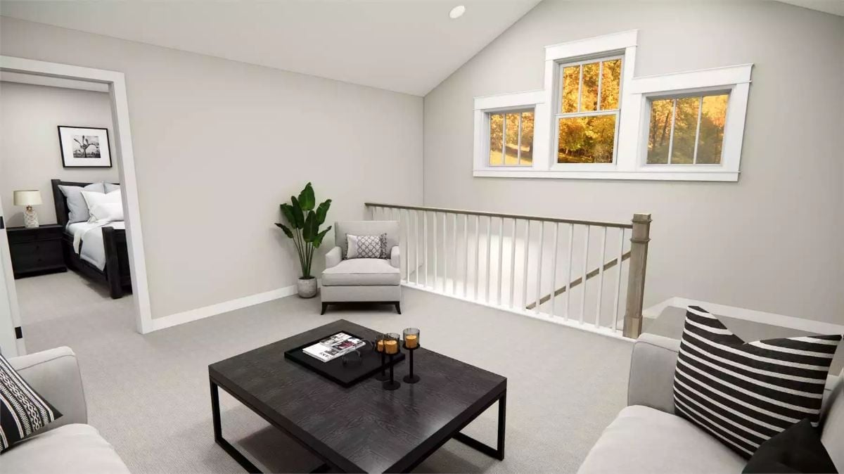 Loft Landing With a Staircase Railing and a View of Fall Trees Outside