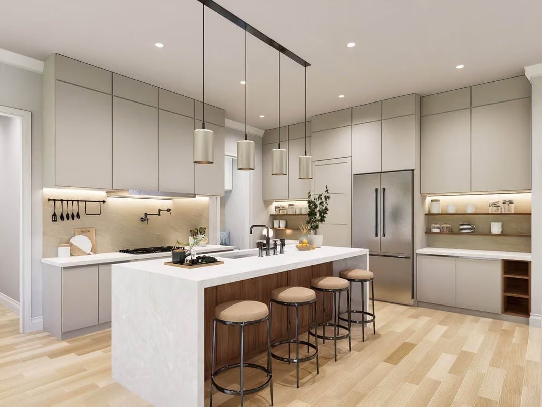 Greige Cabinets and a Waterfall Island That Make the Kitchen Feel Like a Hotel Suite