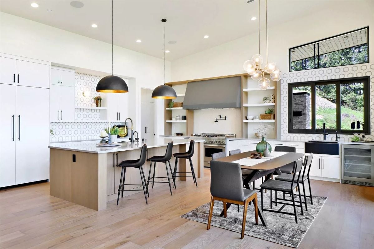 Dome Pendants and an Oversized Island Earn Their Keep in an Open Kitchen