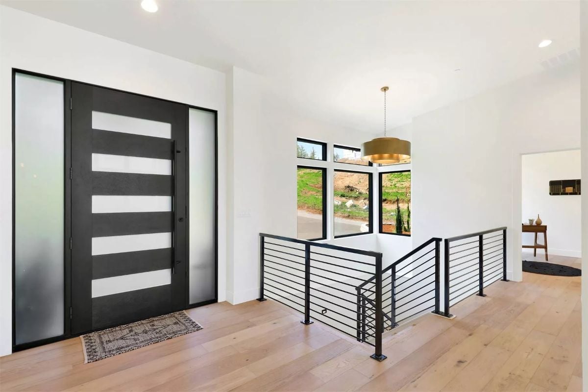 Frosted Glass and Black Steel Set the Tone Before You're Even Inside