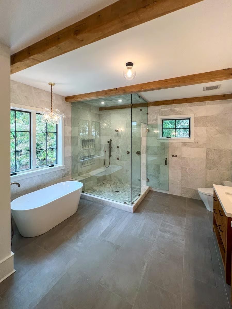Freestanding Soaker Tub and a Glass Shower Built for Two Sharing One Gorgeous Wall