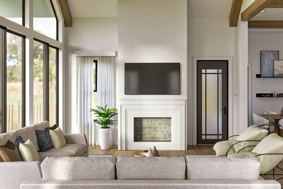 Soaring Walls, Green Tile Firebox, and Sofas That Mean Business