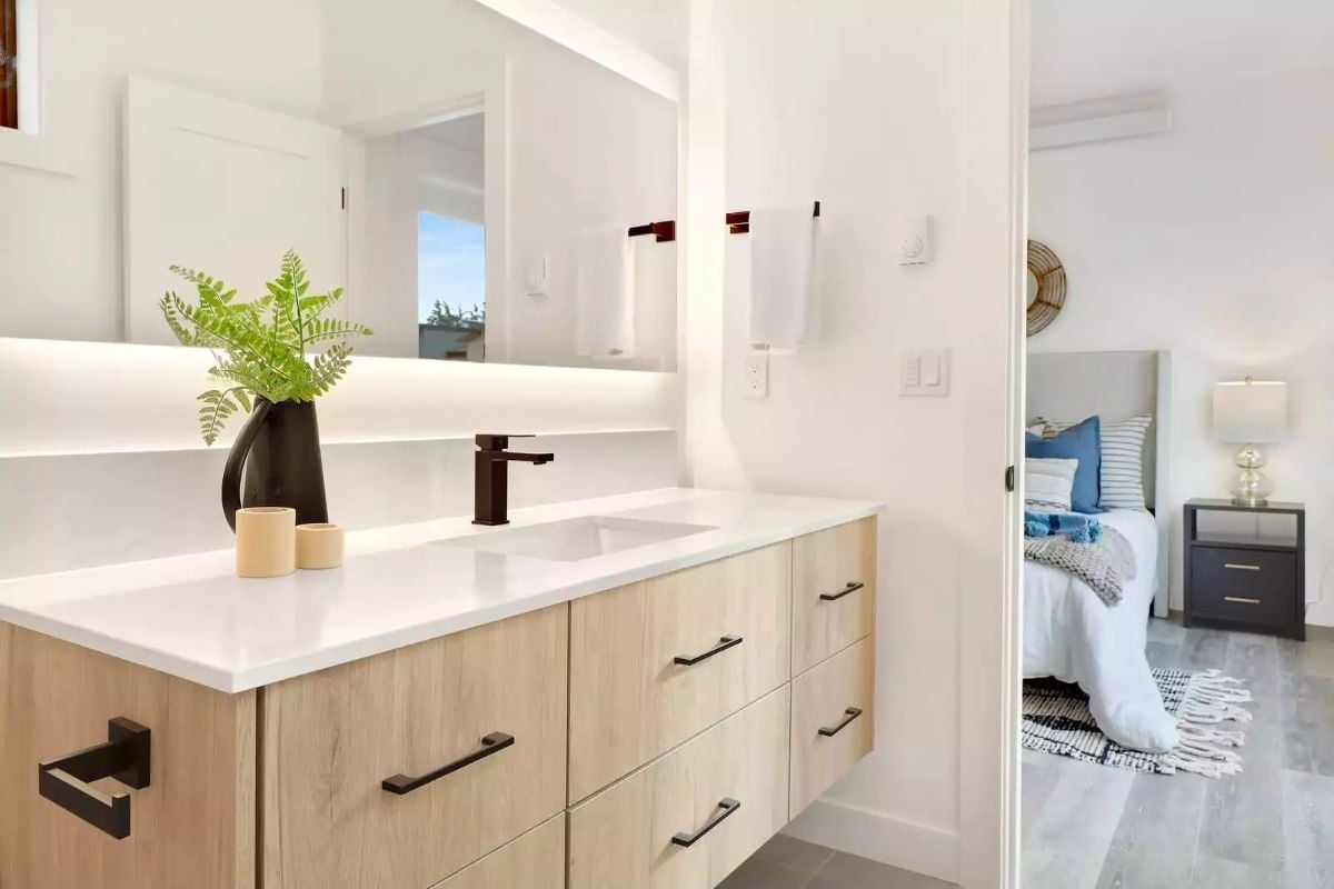 Floating Vanity and Backlit Mirror Make a Compact Bathroom Feel Like a Spa
