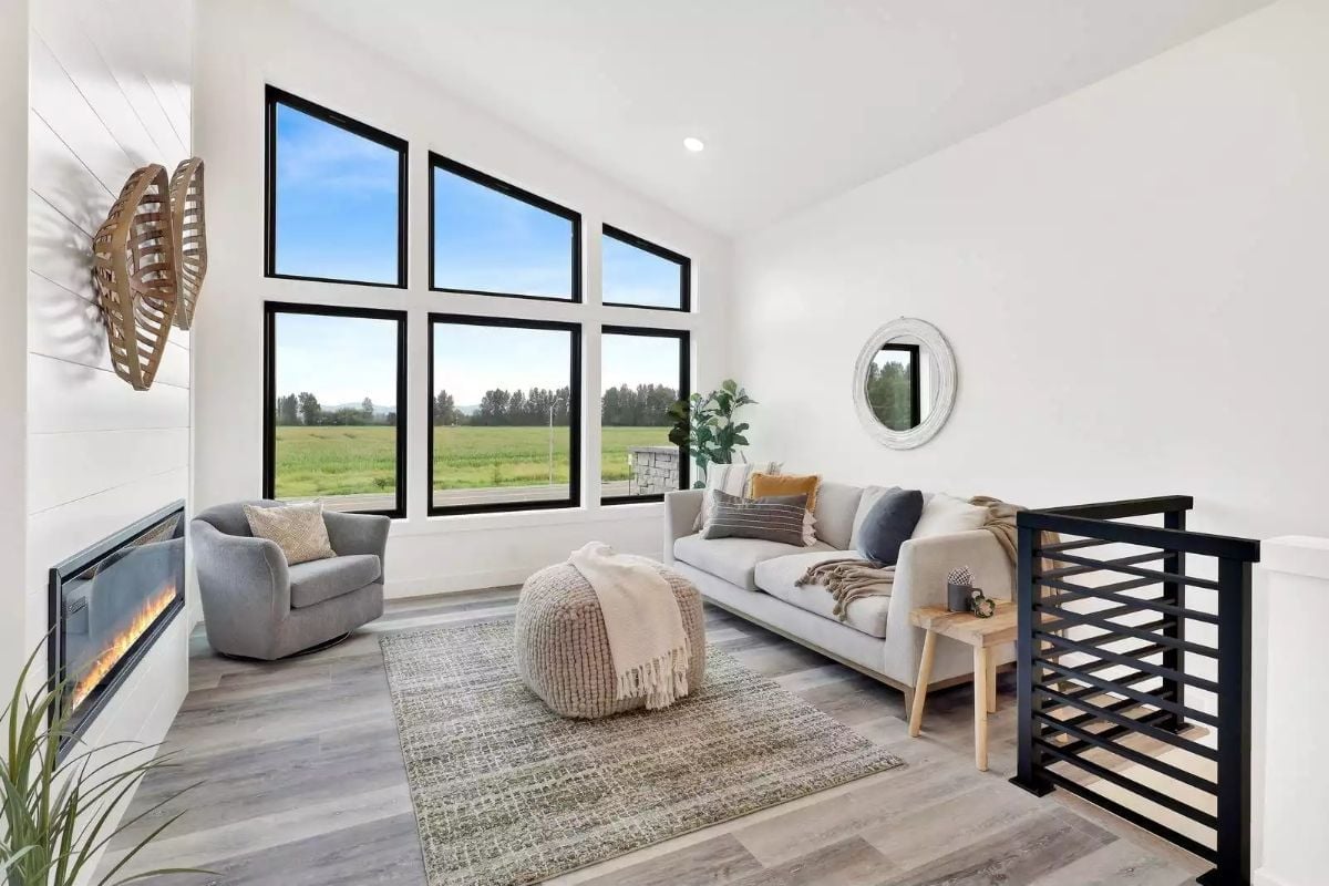 Knitted Poufs and Low Sofas Keep the Sightlines Open to the Fields Beyond
