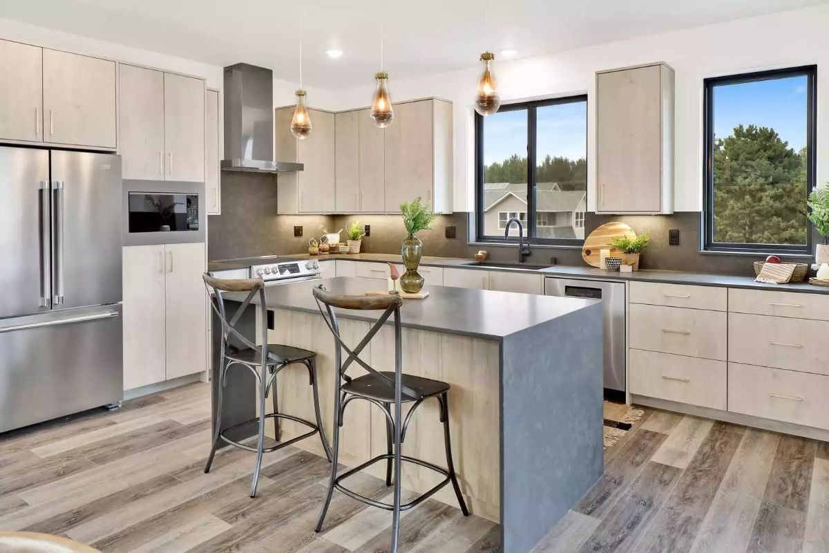 Pendant Lights Earn Their Place Over a Kitchen Island Built for Two