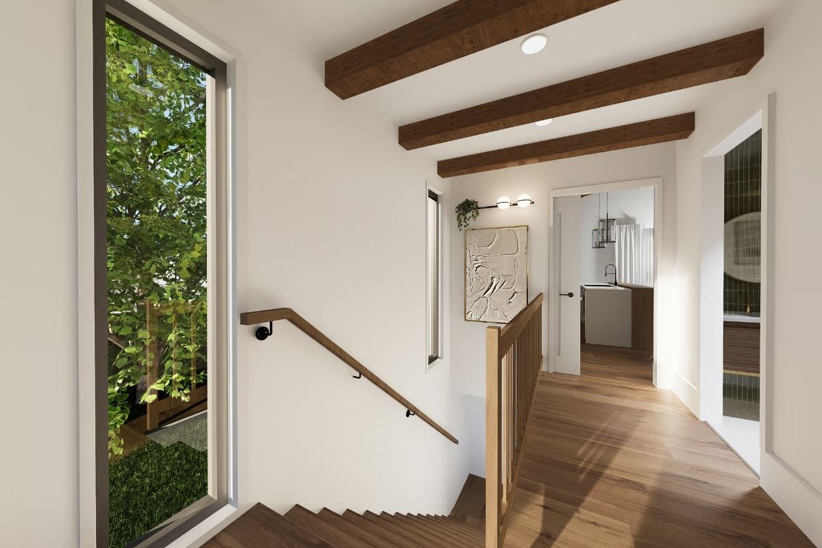 Beamed Ceiling and Stair Landing Work Together to Define the Upper Hallway