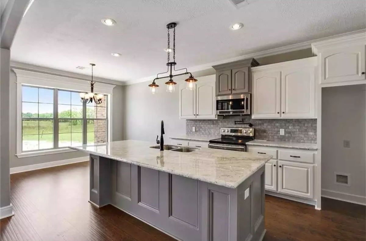 Gray Island, White Cabinets, and a Sink Faucet That Commands Attention