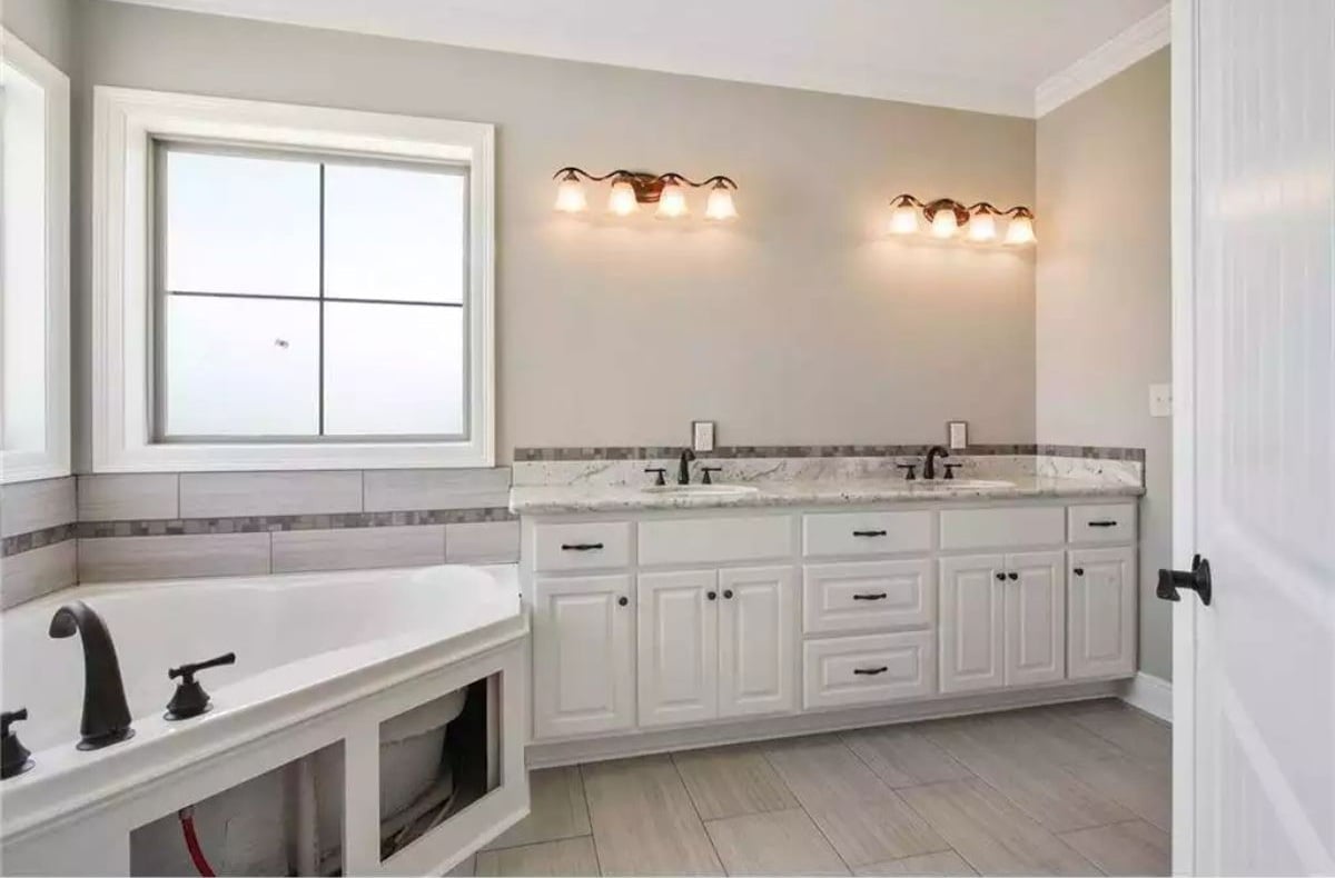 Oil-Rubbed Bronze Against White Cabinetry Is a Combination That Holds Its Ground
