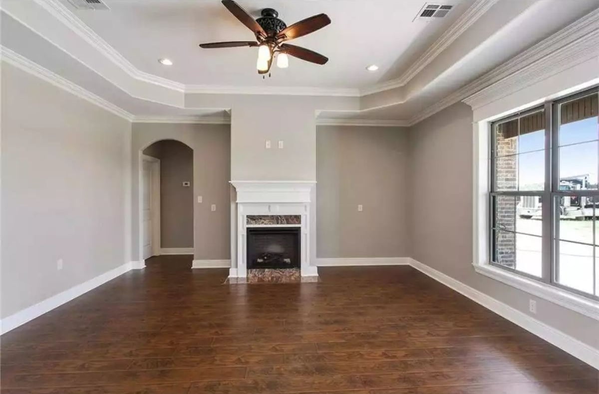 Tray Ceiling and Dark Hardwood Pull the Room Together Before Furniture Arrives