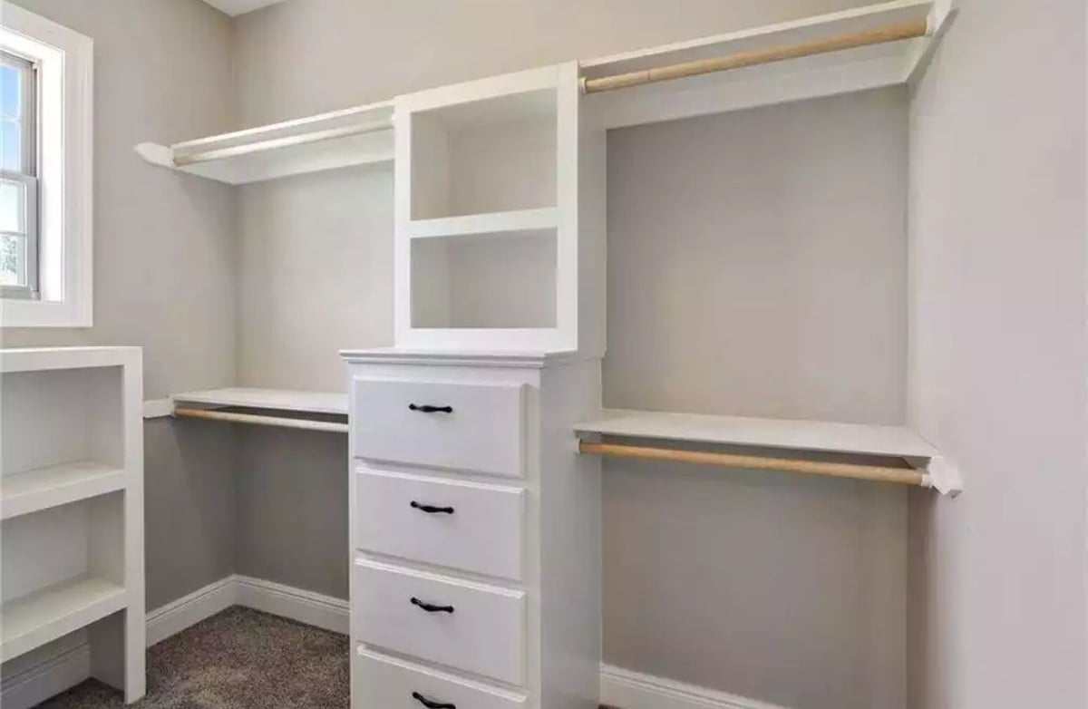 Wood Rods and Four Drawers Keep This Walk-In Closet Honest