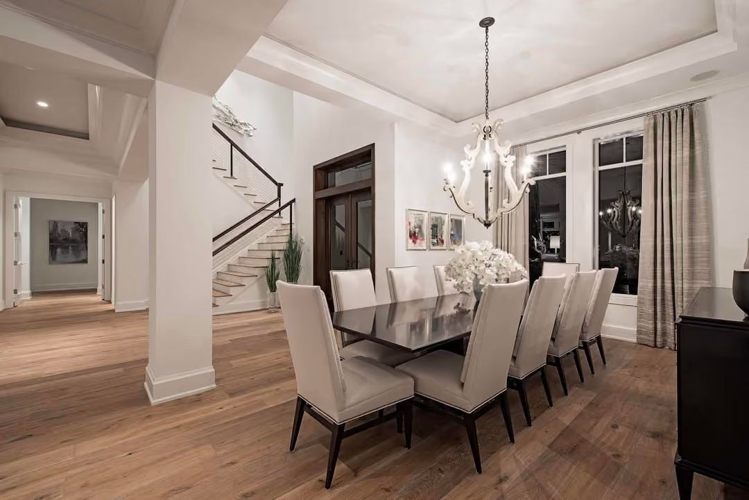 Dark Lacquer Table Anchors a Dining Room Built Around Quiet Contrast