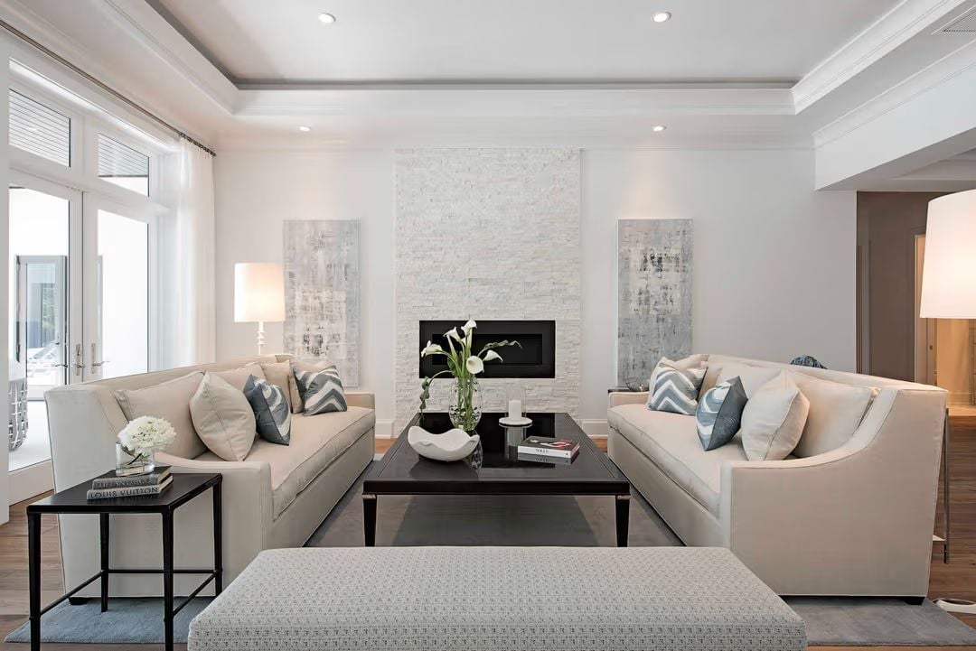Paired Sofas Frame a Stone Fireplace Built for Living In