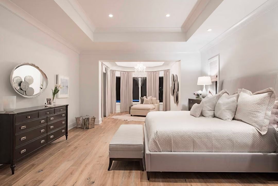 Tray Ceilings and a Sitting Alcove Make This Primary Suite Feel Like Two Rooms