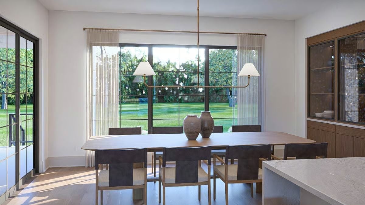 Brass Linear Pendants and Ceramic Vessels That Anchor a Dining Room Without Overpowering It