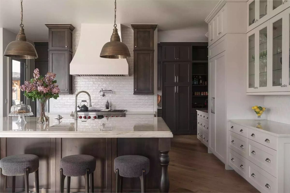Dark Cabinets, White Stone, and Brass That Earns Its Keep