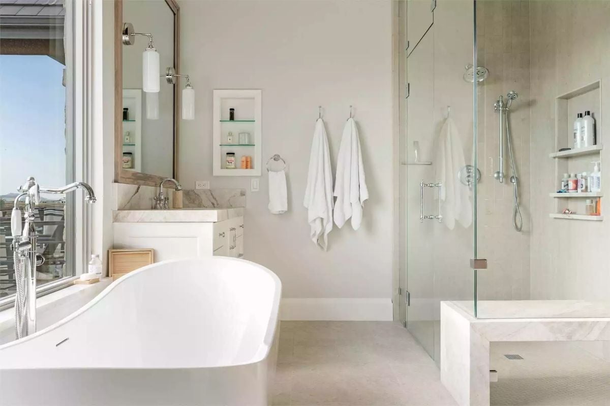 Freestanding Tub, Glass Shower, and a Marble Bench That Does Real Work