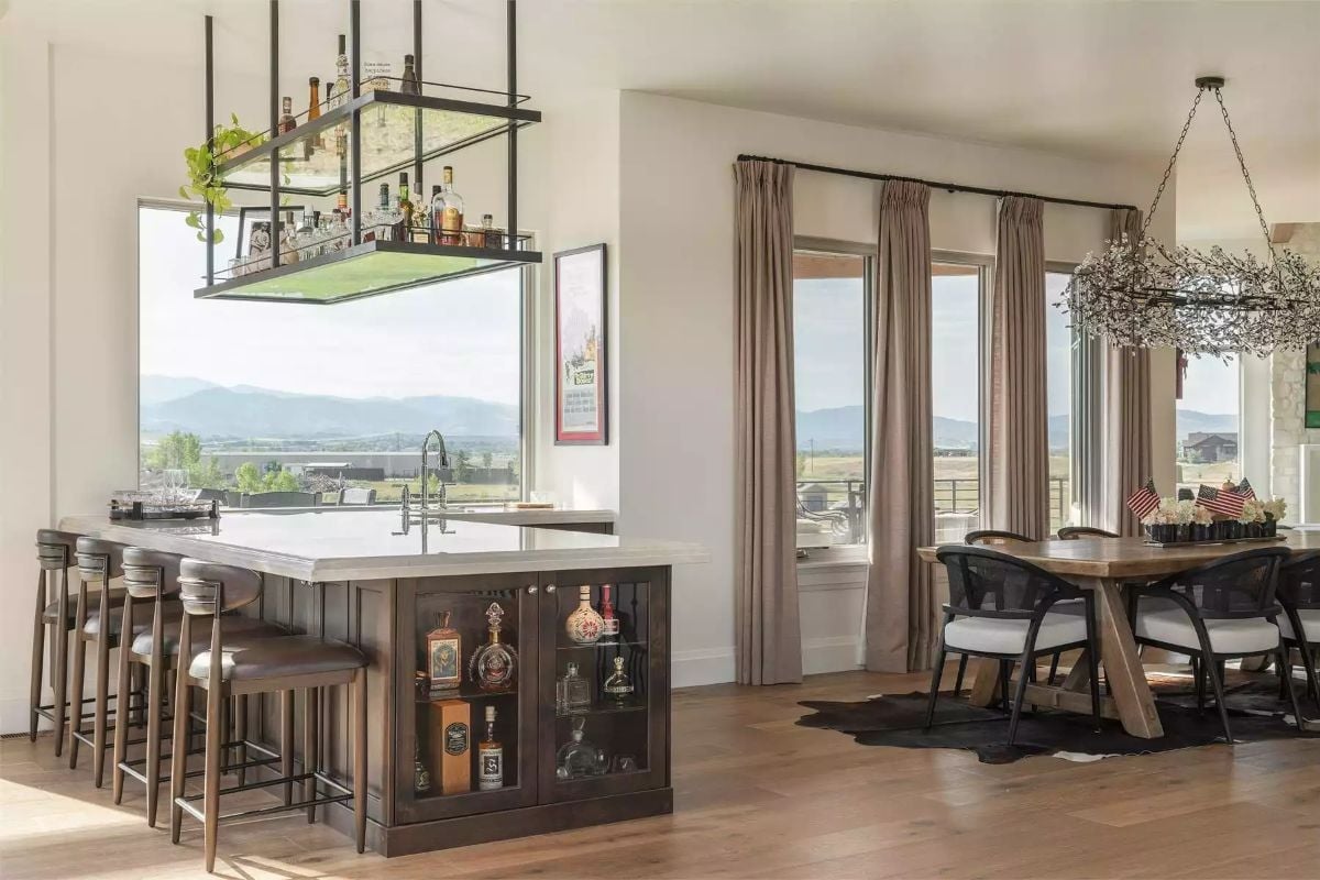 Suspended Bar Shelf Above a Kitchen Island With Mountain Views