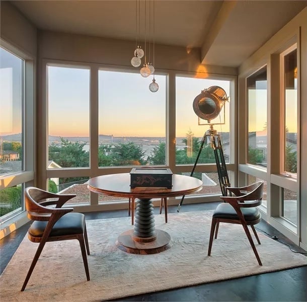 Pedestal Table and Tripod Spotlight Define a Sitting Room Worth Lingering In
