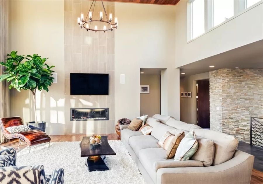 Soaring Tile Surround and a Linear Fireplace Pull This Living Room Together