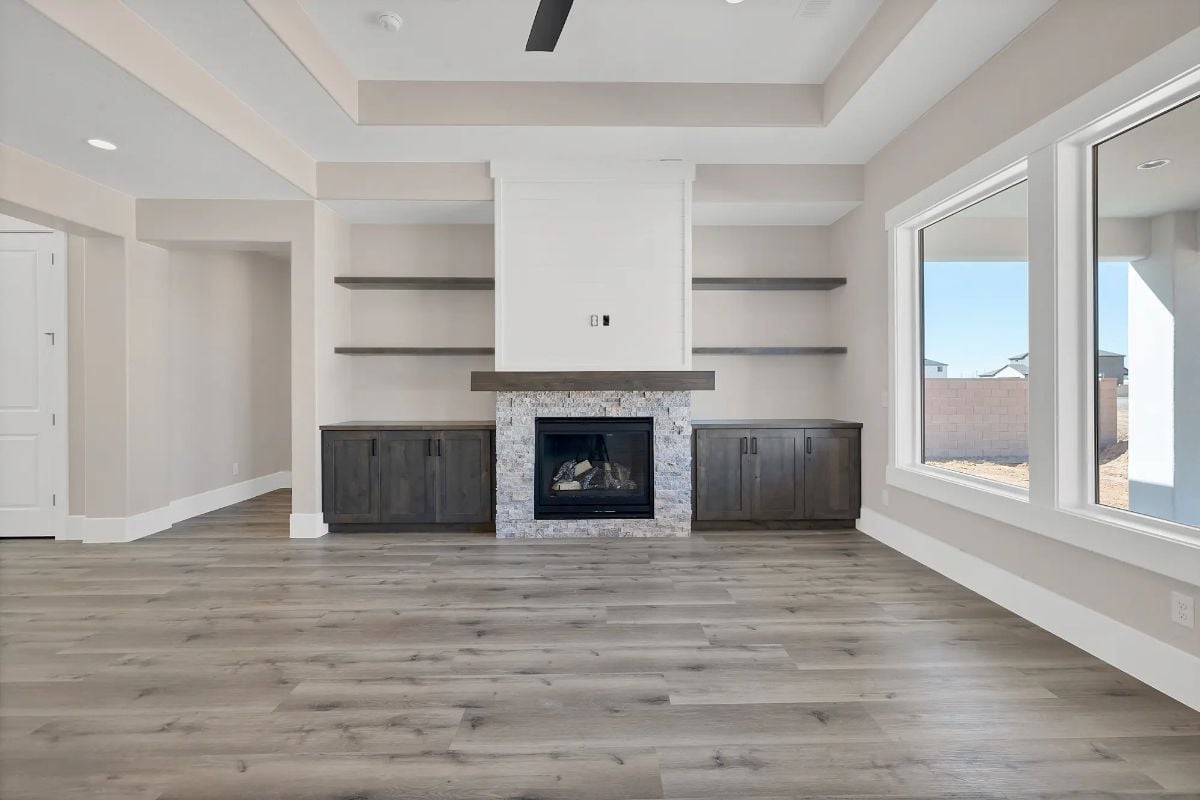 Floating Shelves and a Stone Fireplace Pull the Whole Wall Together