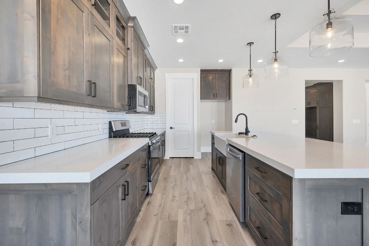 Gray-Stained Cabinetry and Quartz Counters Pull Off Rustic Without Trying Too Hard