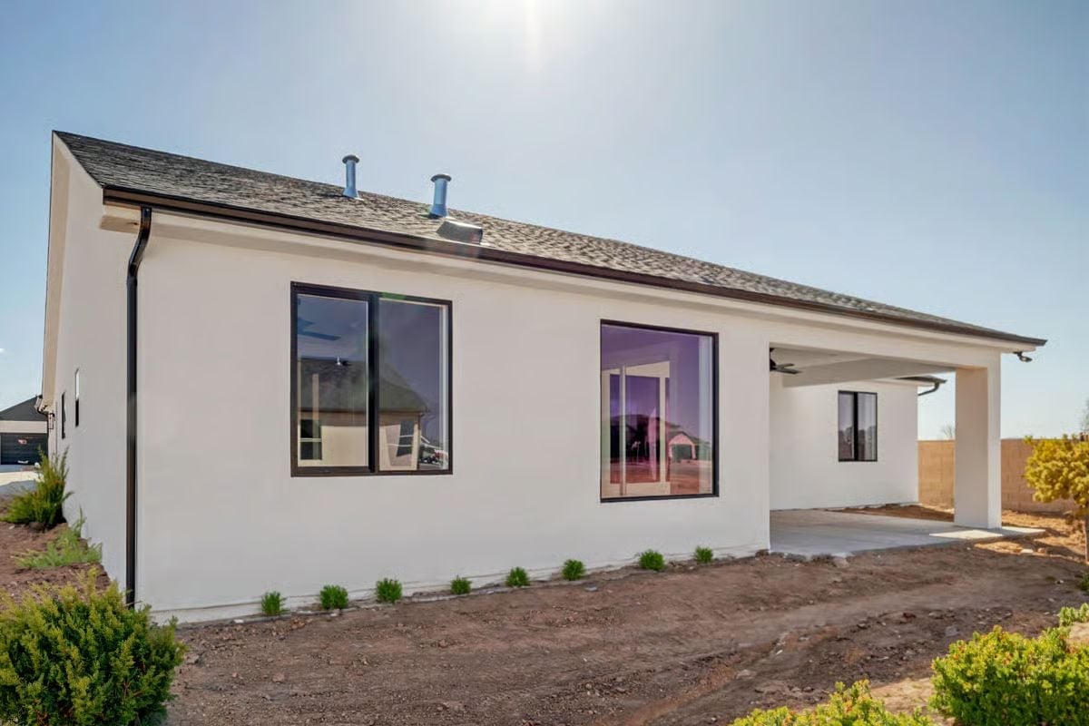 White Stucco and Black Frames Do a Lot of Heavy Lifting Out Back