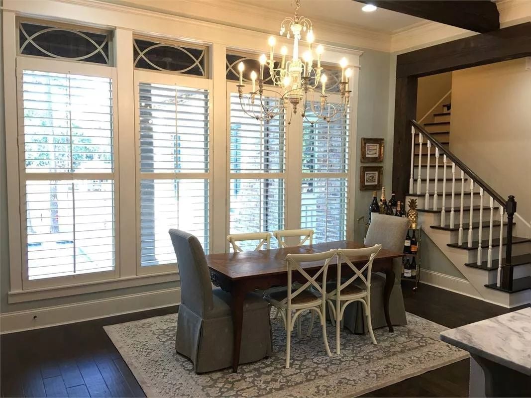 Cross-Back Chairs and Candlestick Chandelier Pull Off a French Country Hybrid